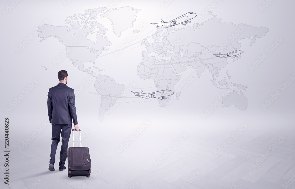 Businessman in dark suit planning his trip in a front of a map
Businessman in dark suit planning his trip in a front of a map