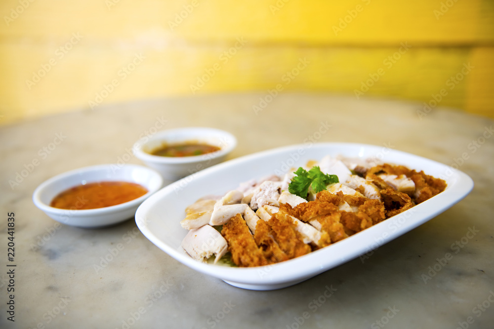 The fried chicken in a dish with cucumber, eat with rice as foods that are beneficial to the body, Fast Food commonly eaten in the countries of Thailand The fried chicken in a dish with cucumber, eat with rice as foods that are beneficial to the body, Fast Food commonly eaten in the countries of Thailand