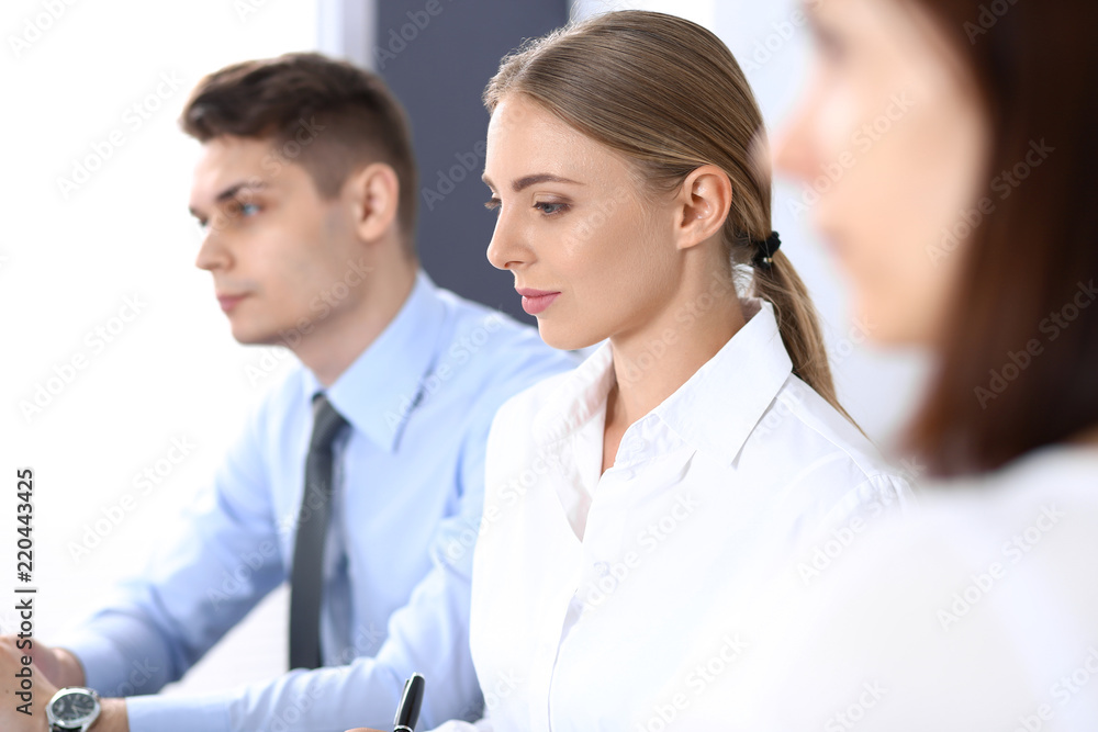 Group of business people or lawyers discussing terms of transaction in office. Meeting and teamwork concept Group of business people or lawyers discussing terms of transaction in office. Meeting and teamwork concept