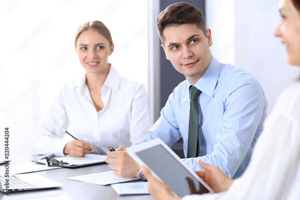 Group of business people or lawyers discussing terms of transaction in office. Meeting and teamwork concept Group of business people or lawyers discussing terms of transaction in office. Meeting and teamwork concept