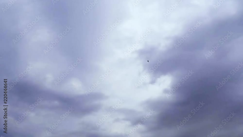 Clouds moving across the sky at Extremely high speeds . No view of the ground or any objects. Clouds only. Clouds moving across the sky at Extremely high speeds . No view of the ground or any objects. Clouds only.