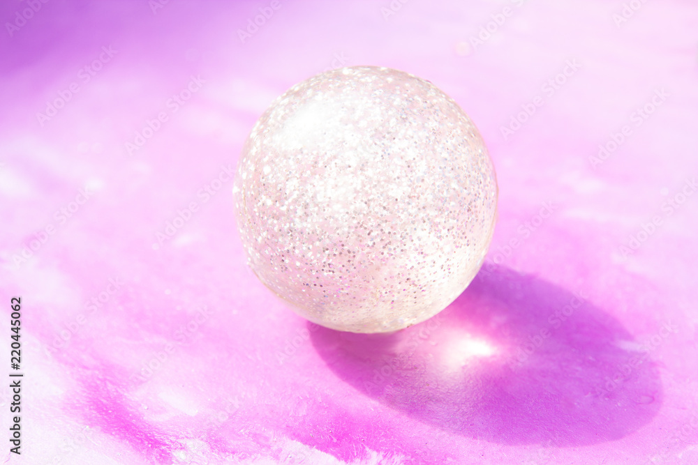 ball with sparkles on a pink background ball with sparkles on a pink background