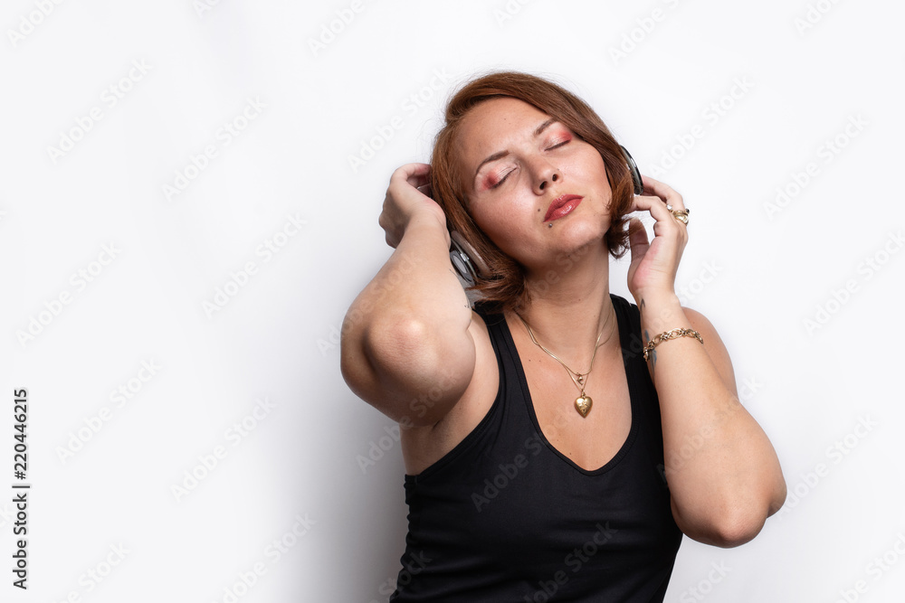 Woman deeply enjoing music with eyes closed Woman deeply enjoing music with eyes closed