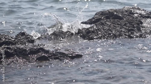 Wallpaper Mural Sea waves splashes on the rocks in slow motion Torontodigital.ca