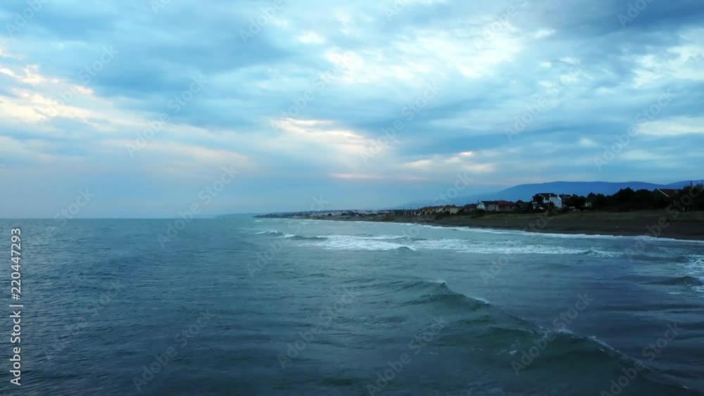 drone flying over the sea near the beach at sunset in turkish coast of black sea, kocaali drone flying over the sea near the beach at sunset in turkish coast of black sea, kocaali