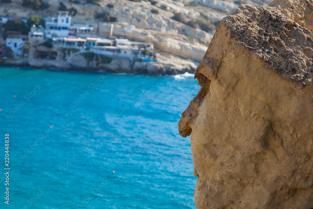 People head-like rock near one of the famous beach Matala. Crete, Greece.