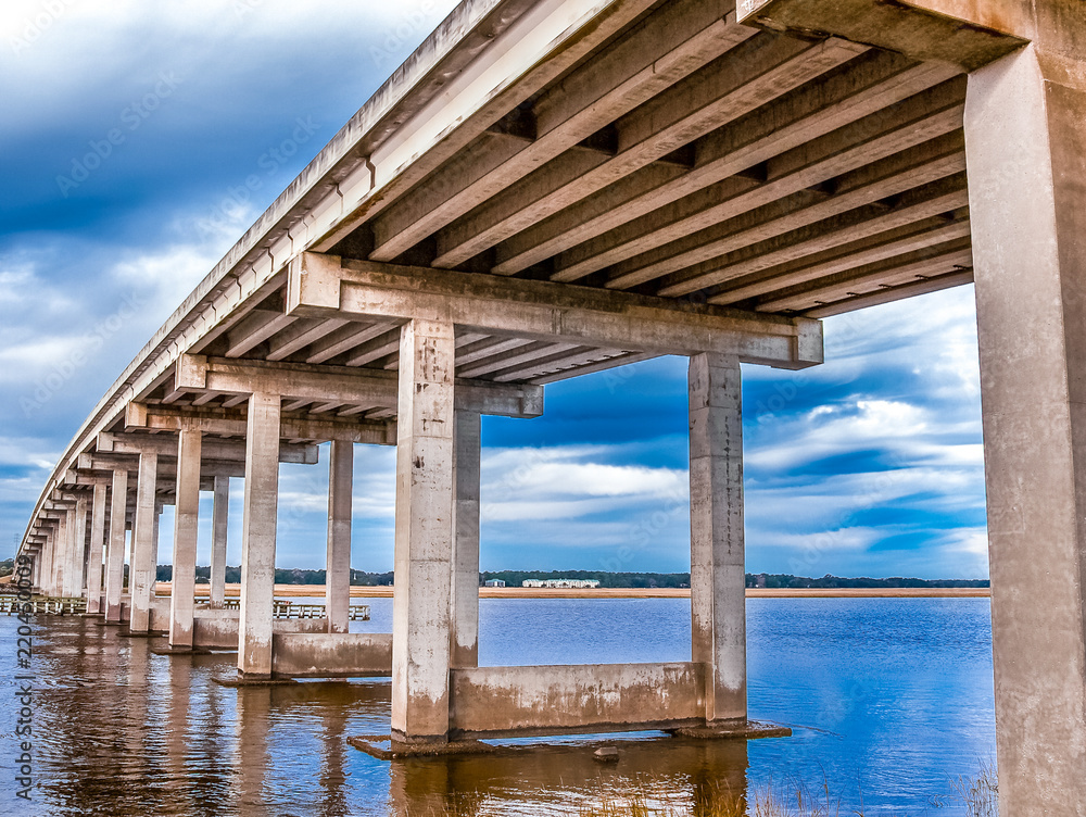 Concrete Bridge Spanning Shallow Water Concrete Bridge Spanning Shallow Water