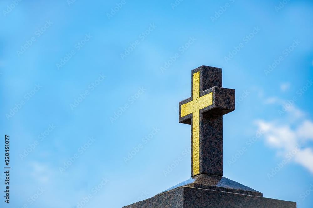 Marble Catholic cross on the background of the sky
