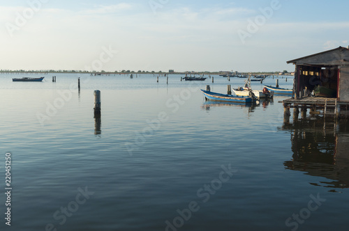 Mussel cultivation, boats at Scardovari lagoon, Po' river delta, Adriatic sea, Italy, UNESCO World Heritage Site. © Asuriel77