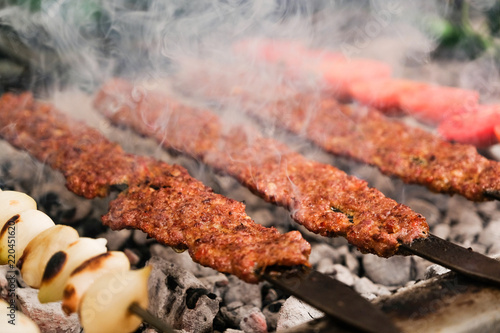 Turkish food Adana Kebab meat on the grill photo