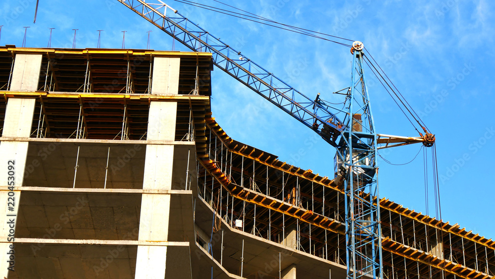 Construction site with crane and building.Construction crane. Construction site with crane and building.Construction crane.