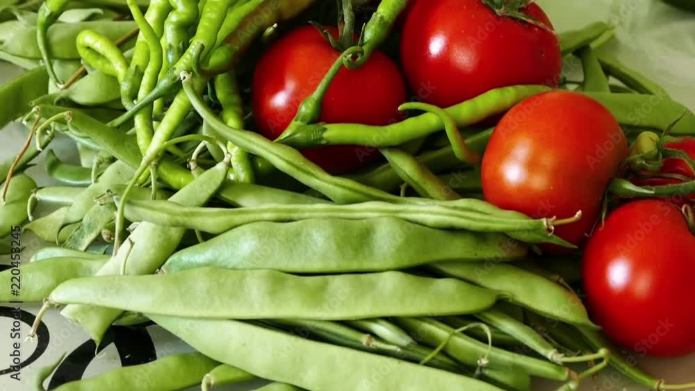 In the kitchen there is green beans, tomatoes and fine pepper,
In the kitchen there is green beans, tomatoes and fine pepper,