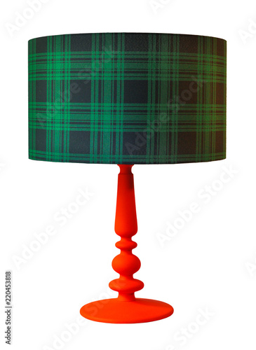 Table lamp with green plaid pattern lampshade on white background. photo