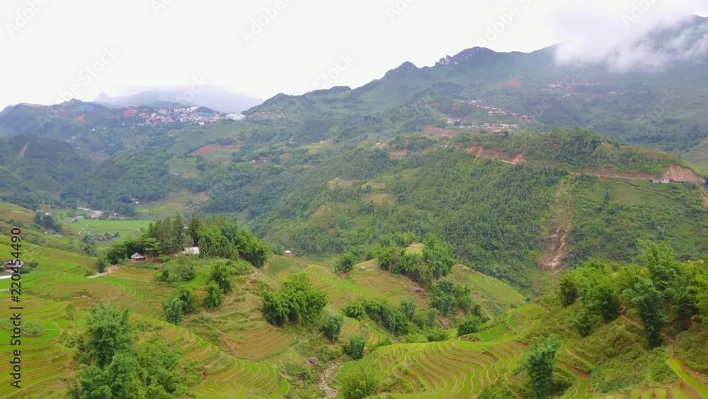 Aerial view of the terraced rice fields, flying towards town of Sapa, Northenr Vietnam Aerial view of the terraced rice fields, flying towards town of Sapa, Northenr Vietnam