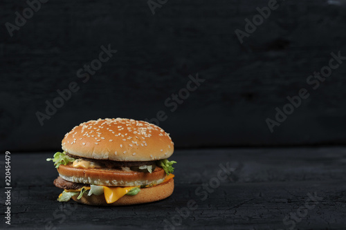 fresh tasty burger on black