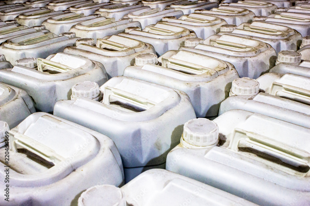 Fototapeta premium Plastic gallons , store agricultural pesticides, in a resale