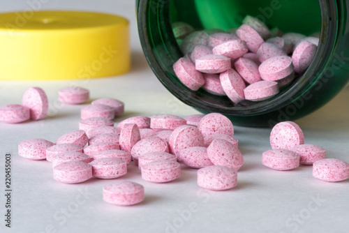 фотографія Vitamin B12 Tablets Spilled from the Bottle