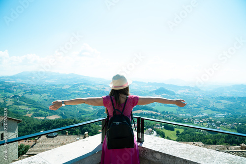 A beautiful touristic girl in the San Marino, admiring the view © petrustan