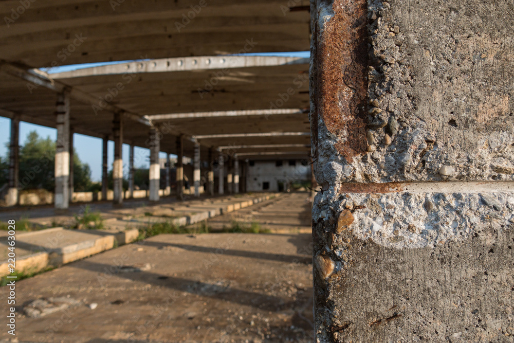 A deserted industrial plant site with old deserted structure on a beautiful sunset. A deserted industrial plant site with old deserted structure on a beautiful sunset.