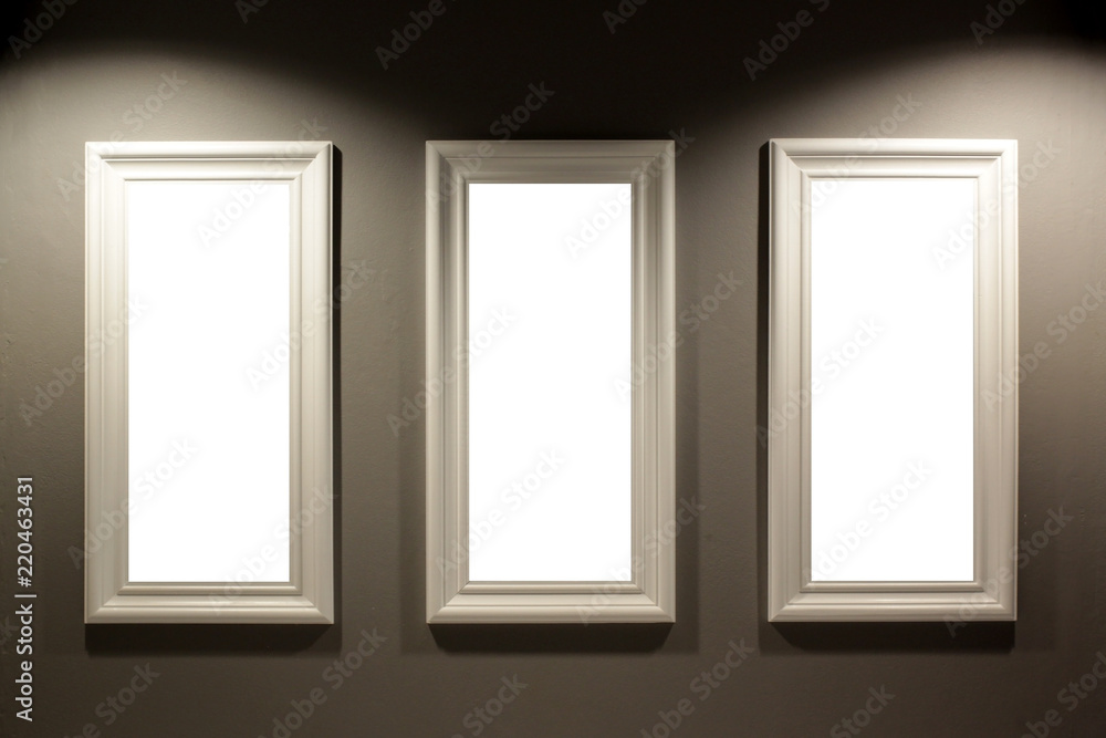empty picture frames on the wall with lighting empty picture frames on the wall with lighting