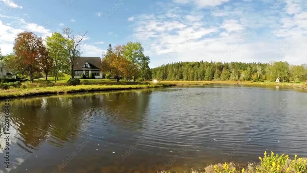 Farm house overlooking a placid river Farm house overlooking a placid river