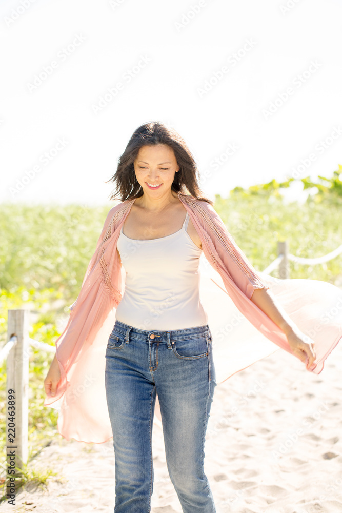 Portrait of an Asian woman smiling.