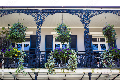 Black and White Balcony with Spring Flower Baskets Overlooking the French Quarter in New Orleans, Louisiana, USA