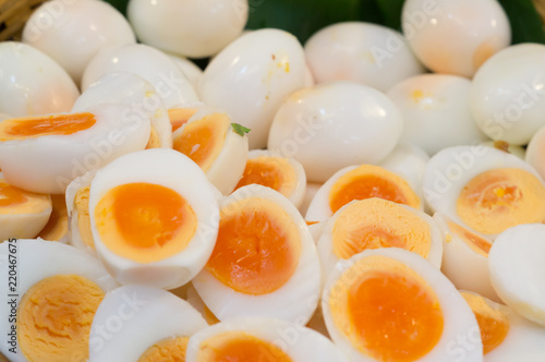Peeled boiled eggs in both whole and half shape