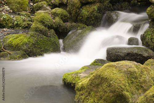 Flowing motion of Waterfall photo