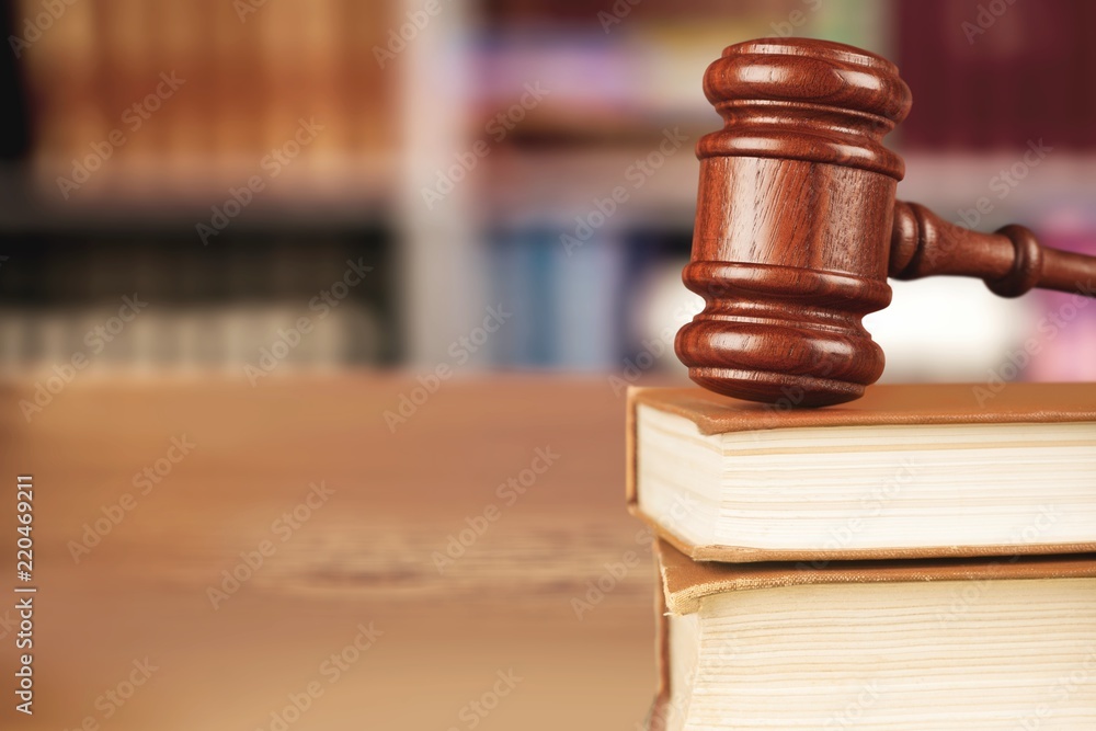 Judge hammer and documents on wooden table Judge hammer and documents on wooden table