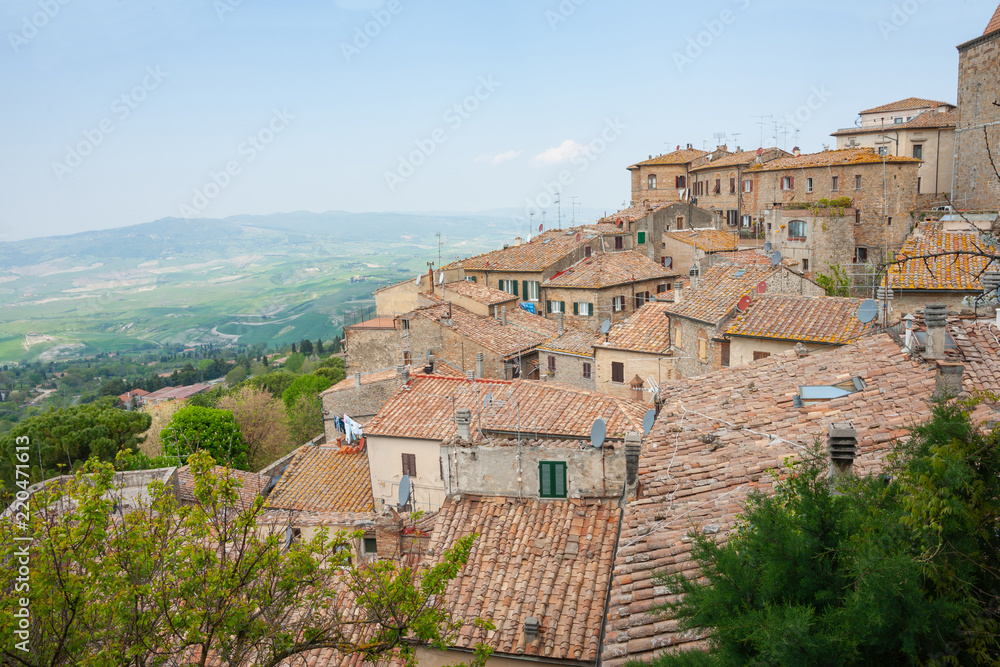 Tiered roofs over homes built up slope of hillside