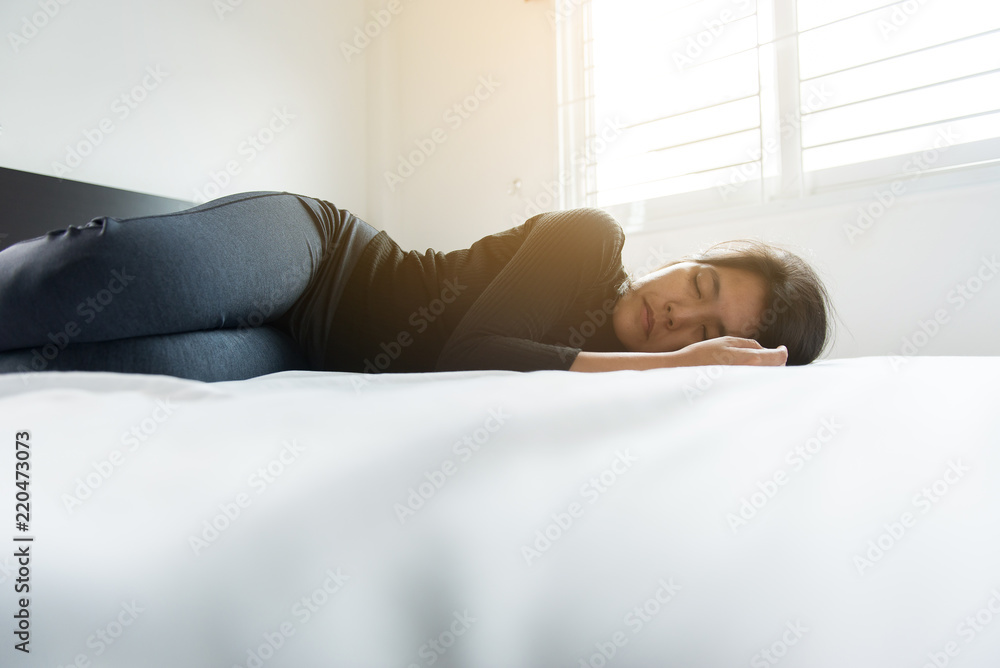 Mental disorder,woman laying down depression have a headache and feeling lonely in bedroom Mental disorder,woman laying down depression have a headache and feeling lonely in bedroom