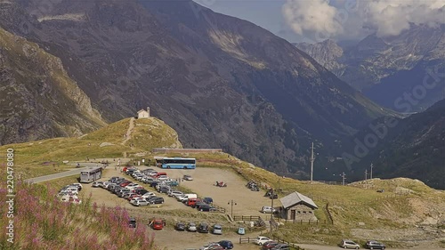 Small church in the alpine panorama. Gran Paradiso National Park - Time lapse. Italy photo