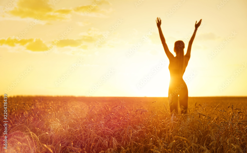 Sporty woman at sunset in wheat field Sporty woman at sunset in wheat field