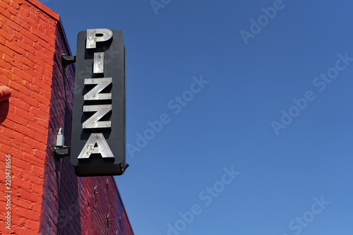 Broken neon Pizza sign