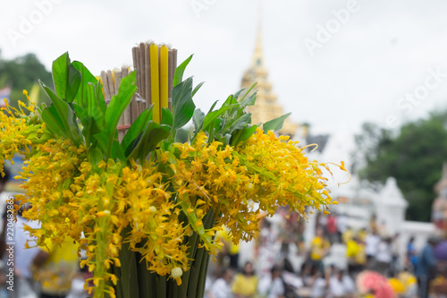 The Globba Schombugkii flowers with candle and joss stick photo