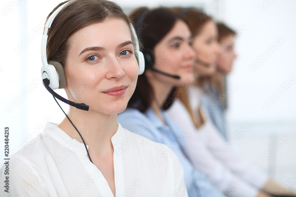 Call center. Beautiful cheerful smiling operator consulting clients with headset. Business concept of customer service Call center. Beautiful cheerful smiling operator consulting clients with headset. Business concept of customer service