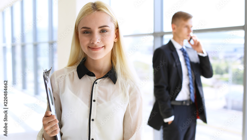 Happy modern business woman or student girl in office hall Happy modern business woman or student girl in office hall