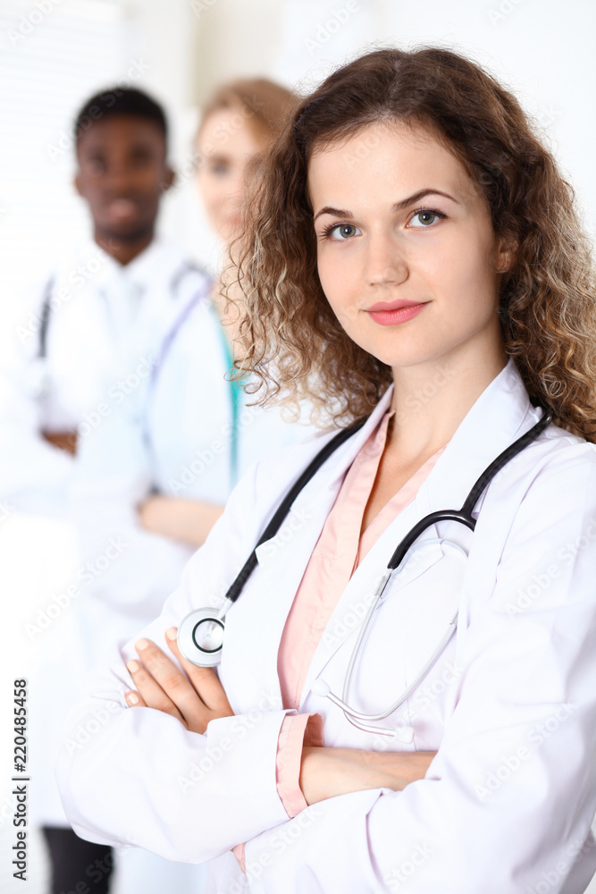 Happy doctor woman with medical staff at the hospital Happy doctor woman with medical staff at the hospital