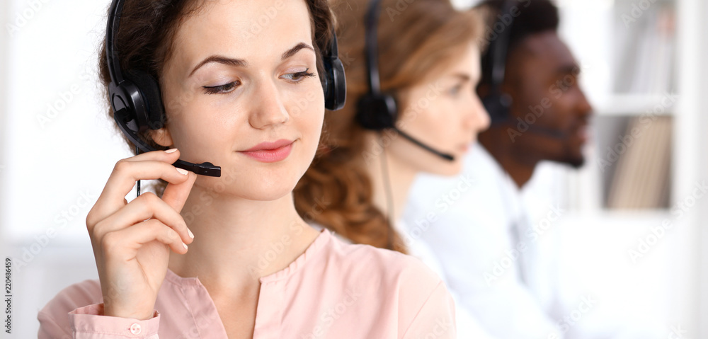 Call center operator.Young beautiful brunette woman in headset. Business concept Call center operator.Young beautiful brunette woman in headset. Business concept