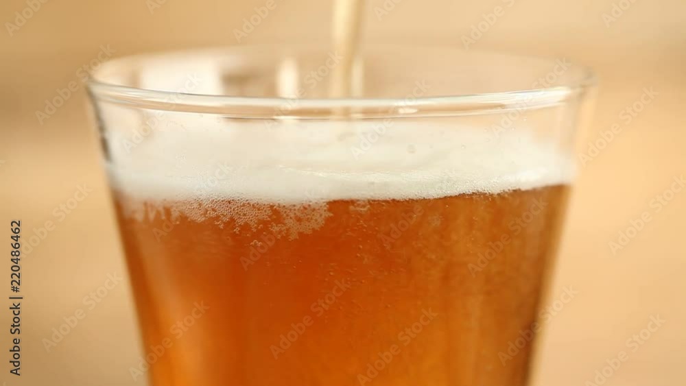 beer is pouring into a glass beer is pouring into a glass