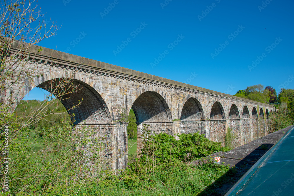 View of the Chirk railway viaduct from a narrowboat on the Chirk Aquaduct. The later built Railway viaduct runs alongside the navigable aquaduct.