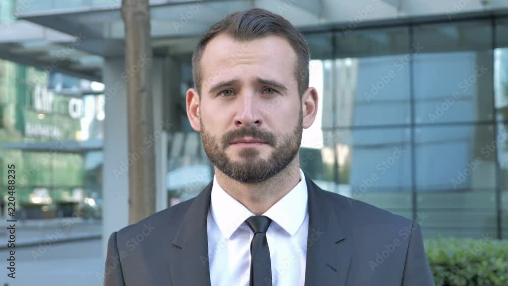 Portrait of Sad Beard Businessman Looking at Camera Portrait of Sad Beard Businessman Looking at Camera
