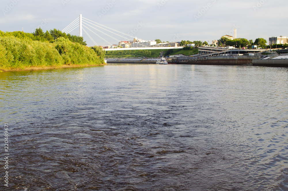 The suspension bridge and Tura River Embankment in Tyumen, Russia.