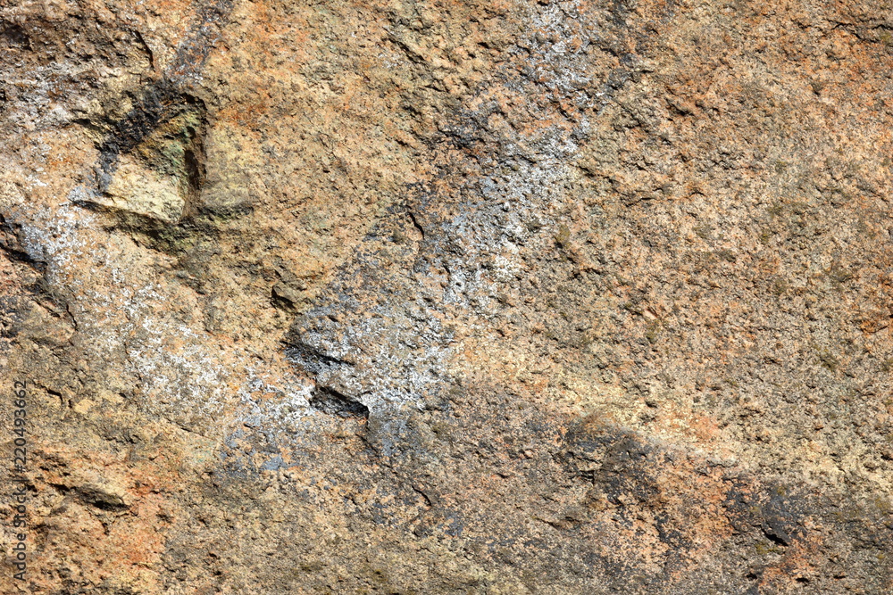 Granite background. Granite stone close up. Texture of natural material. Rocky rocks of ancient times. Natural pattern Granite background. Granite stone close up. Texture of natural material. Rocky rocks of ancient times. Natural pattern