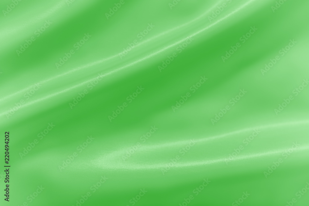 Smooth elegant shiny green silk or satin luxury cloth texture can use as abstract holidays background. Luxurious Christmas background or New Year background design. Smooth elegant shiny green silk or satin luxury cloth texture can use as abstract holidays background. Luxurious Christmas background or New Year background design.