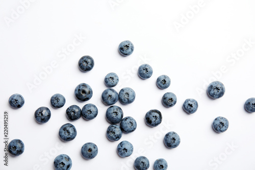 Flat lay composition with tasty blueberry on white background