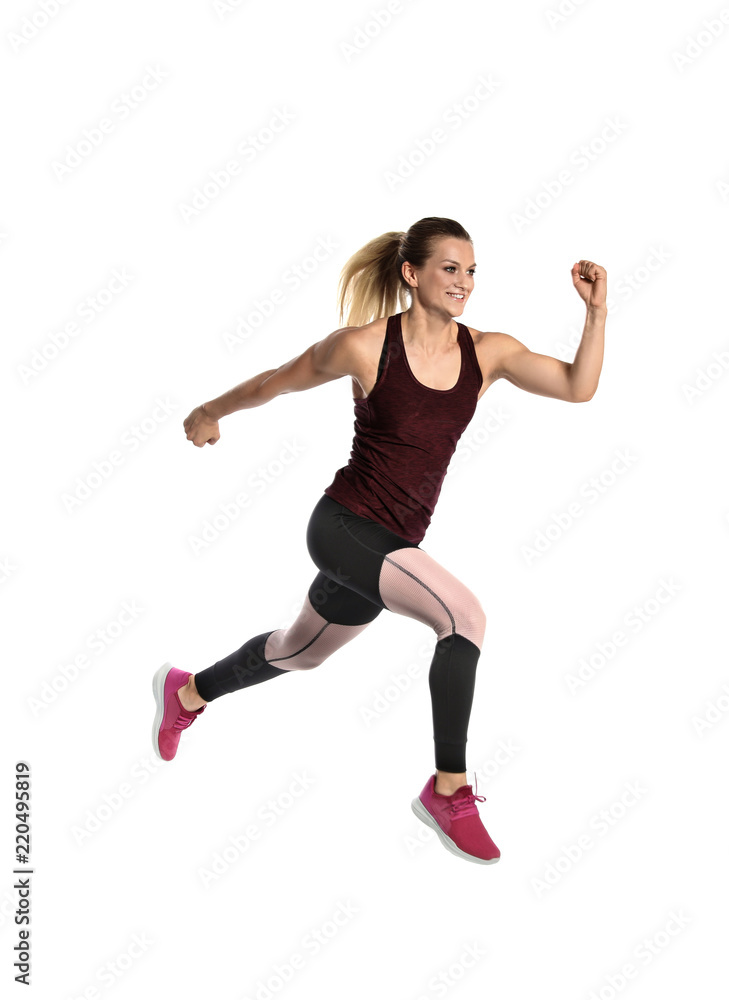 Sporty young woman running on white background