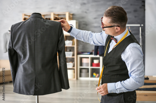 Mature man checking jacket ...