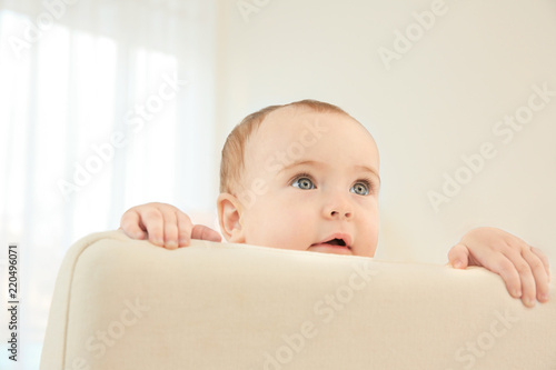 Cute little baby girl at home